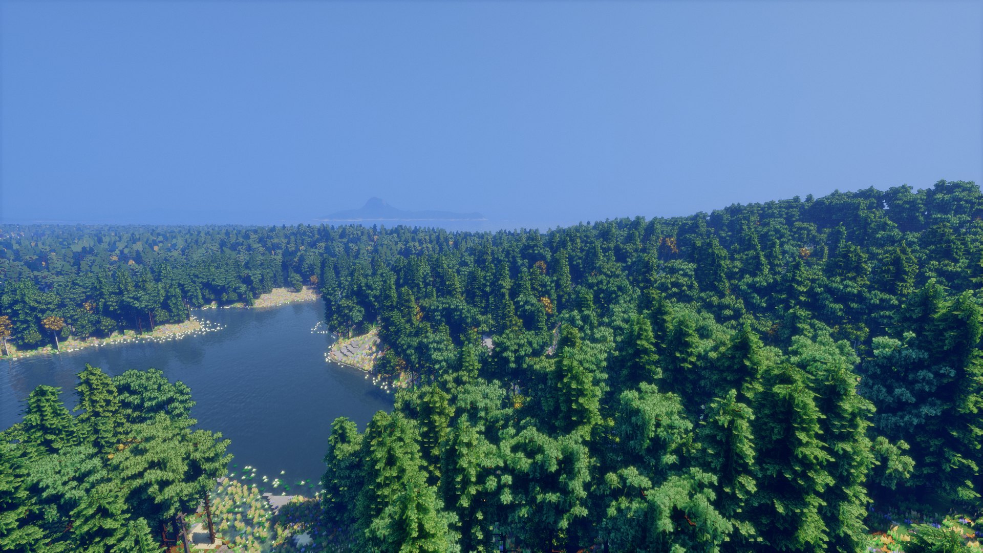 Far View under Bliss: a forested shore and a lake, distant hills in the haze