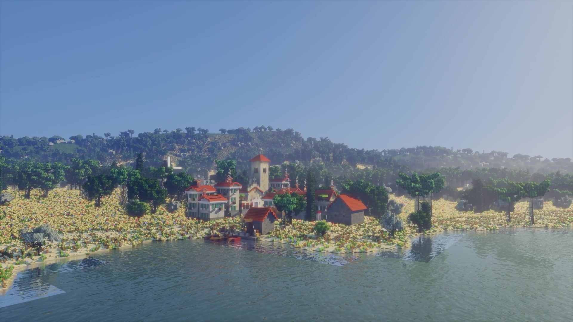 A Mediterranean village on a bay, its campanile over the roofs